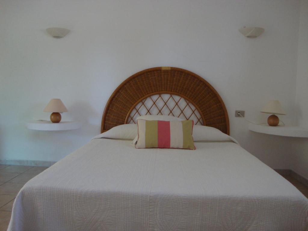 Un ou plusieurs lits dans un hébergement de l'établissement Camping Residence Chalet La Pomposa Terrazzoni