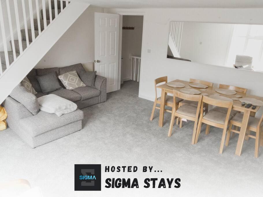 a living room with a couch and a table at Bentley Lofts - By Sigma Stays in Crewe