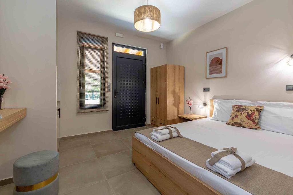 Postel nebo postele na pokoji v ubytování Fragkos Doukas Rooms