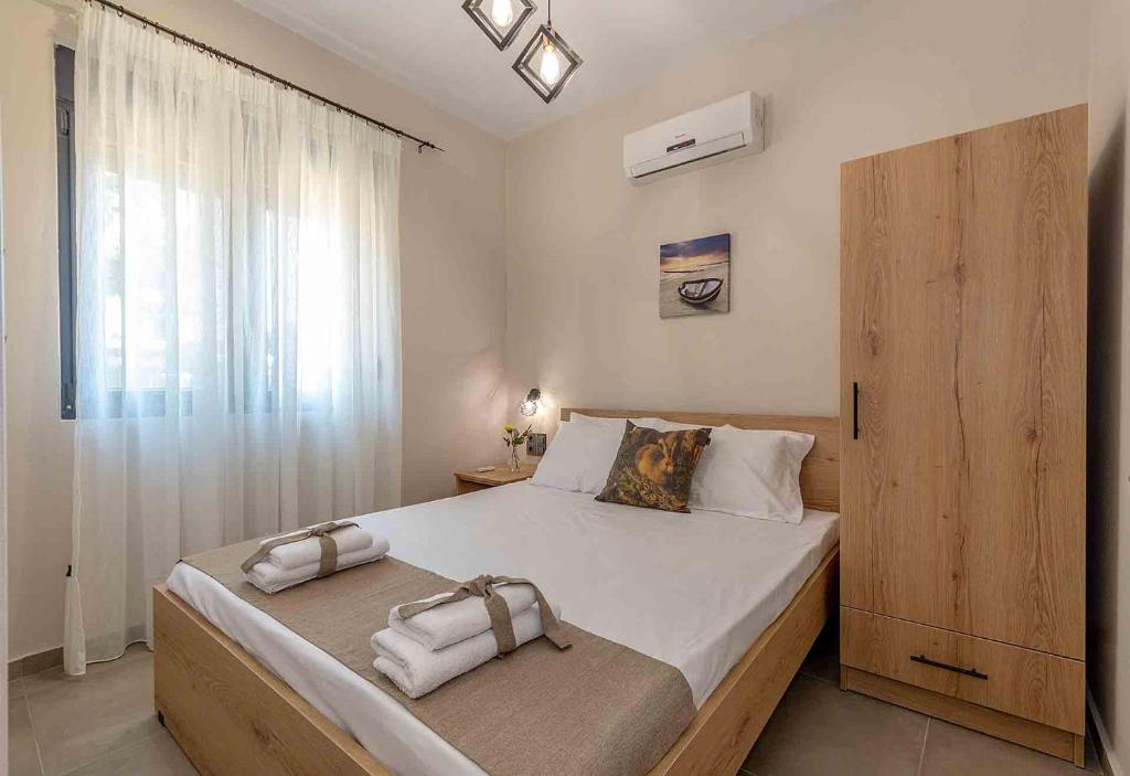 Postel nebo postele na pokoji v ubytování Fragkos Doukas Rooms