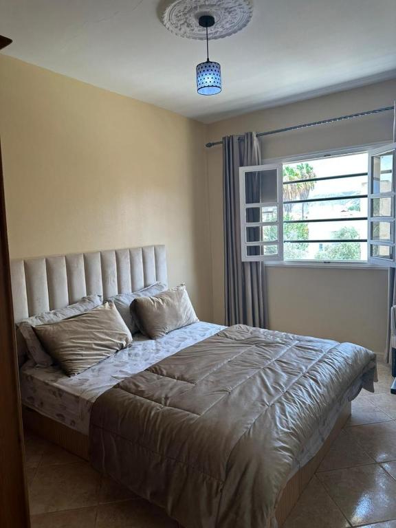 Postel nebo postele na pokoji v ubytování Villa le Palmier