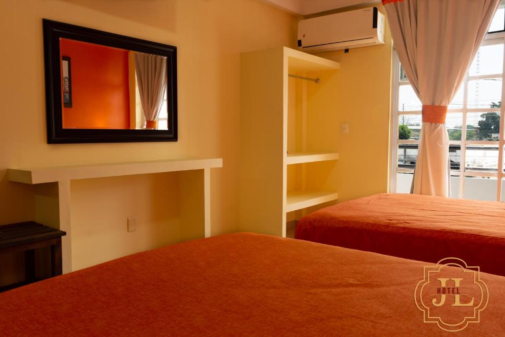 Postel nebo postele na pokoji v ubytování Hotel JL