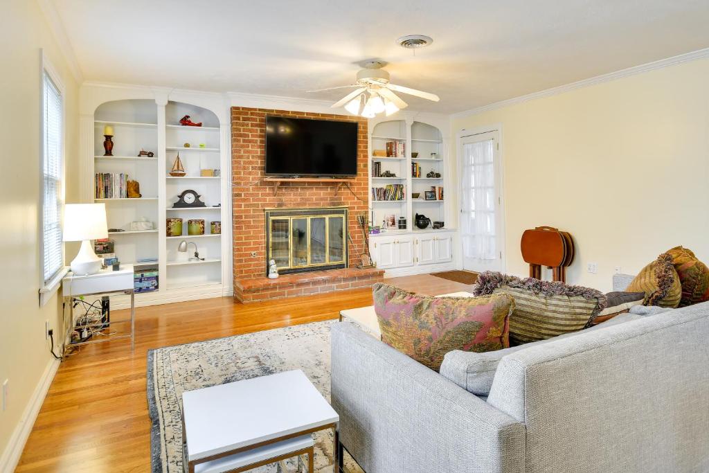 a living room with a couch and a fireplace at Spacious Amarillo Home with Shared Fire Pit! in Amarillo