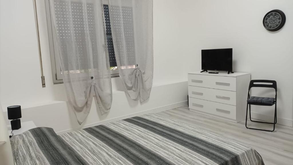 Postel nebo postele na pokoji v ubytování La Laguna Rooms