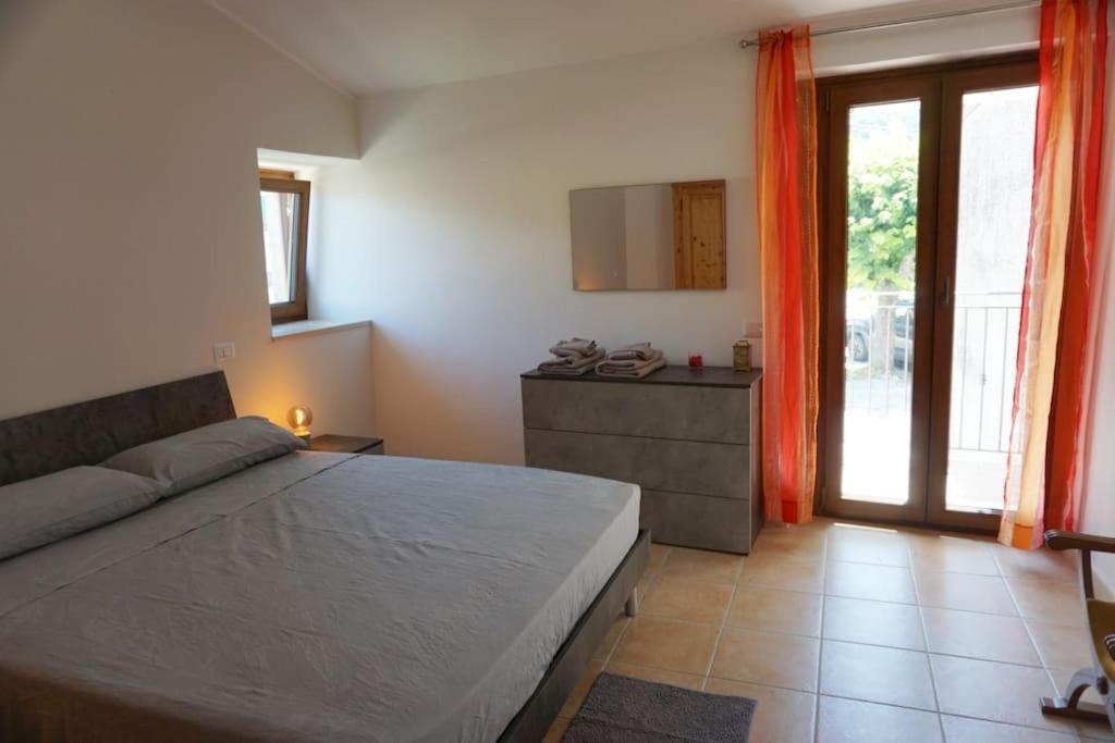 Ένα ή περισσότερα κρεβάτια σε δωμάτιο στο TreeStay - Ampio appartamento moderno completo di tutto