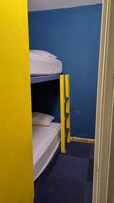 Voodi või voodid majutusasutuse Hostal Panama Experience toas