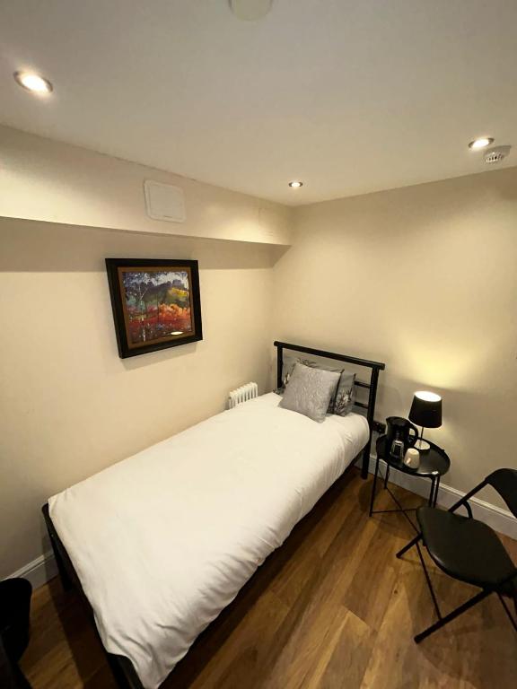 Katil atau katil-katil dalam bilik di Cosy Single Room