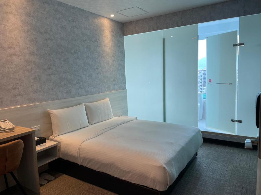 Katil atau katil-katil dalam bilik di 西門雲町旅店 Sky Gate Hotel