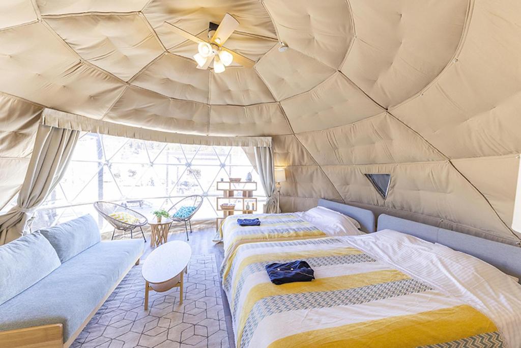 Postel nebo postele na pokoji v ubytování Glamping&Port結