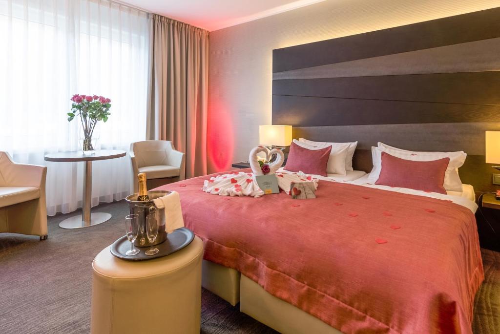 Postel nebo postele na pokoji v ubytování Parc Hotel Alvisse