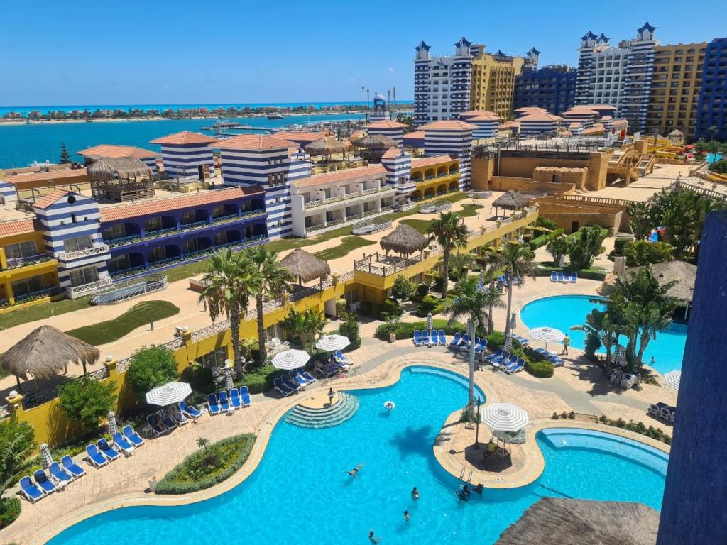 an aerial view of a resort with a swimming pool at Porto marina in El Alamein