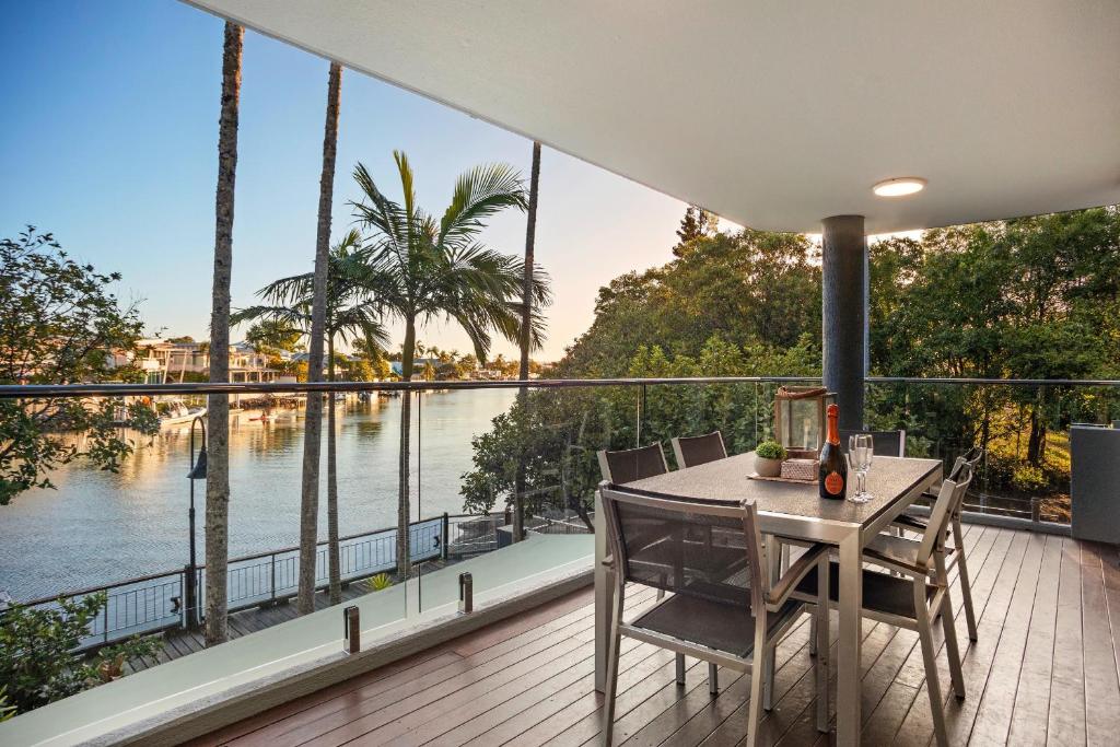 a house with a balcony with a view of the water at #2 Hastings Street in Noosa Heads