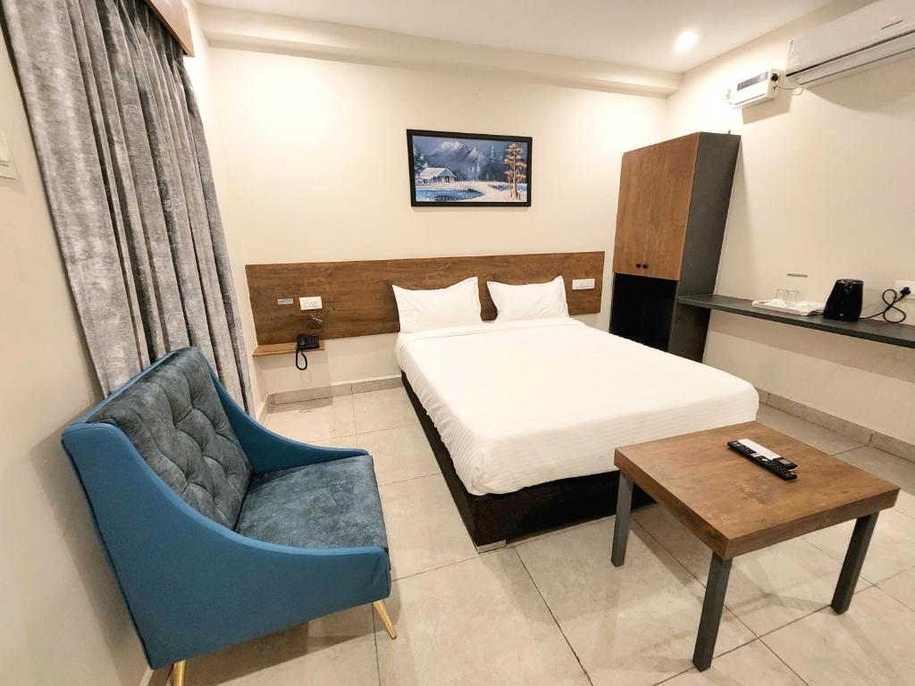 Postel nebo postele na pokoji v ubytování Hotel Park Varaahi