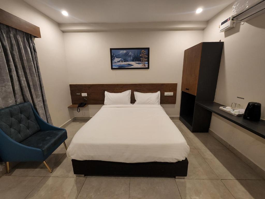 Postel nebo postele na pokoji v ubytování Hotel Park Varaahi