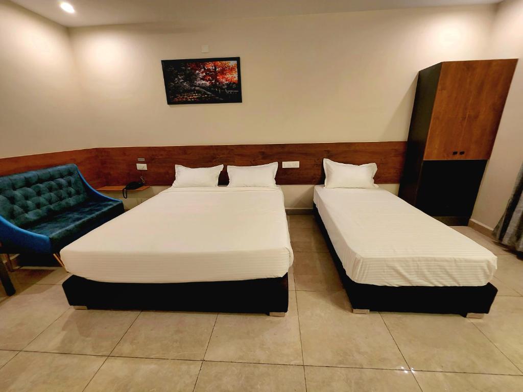 Postel nebo postele na pokoji v ubytování Hotel Park Varaahi