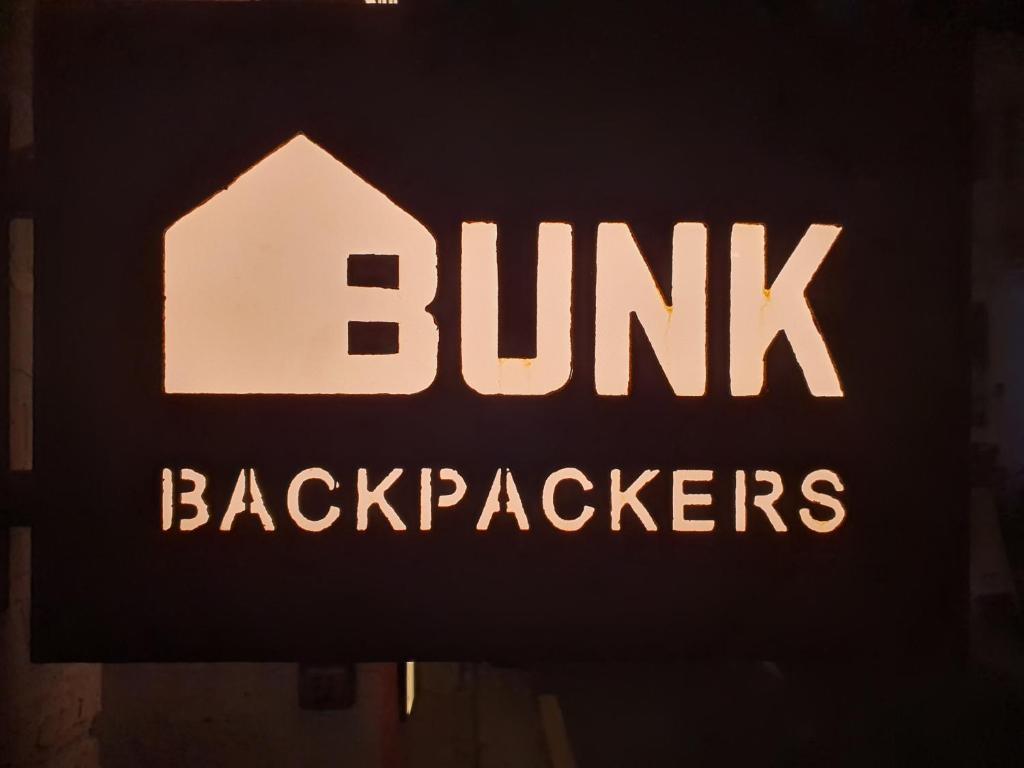 a sign for a building with the words burn back appliances at Bunk Backpackers Guesthouse in Seoul