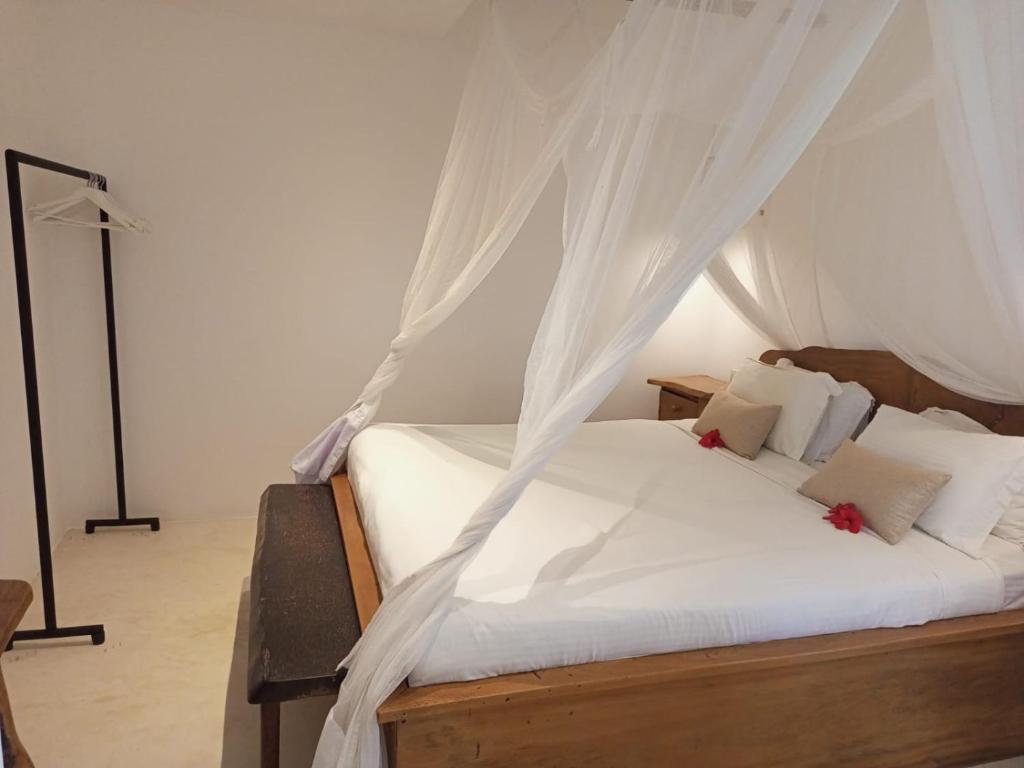 Postel nebo postele na pokoji v ubytování Sonrisa Villas