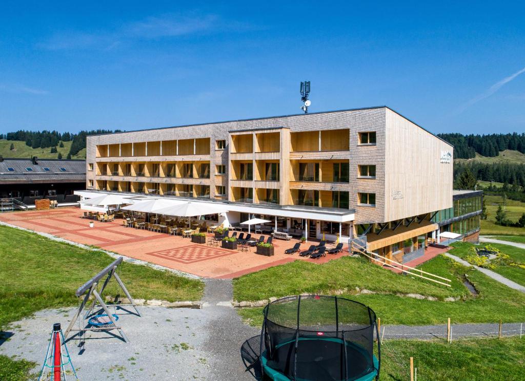 an aerial view of a building with a playground at Almhotel Hochhäderich in Riefensberg