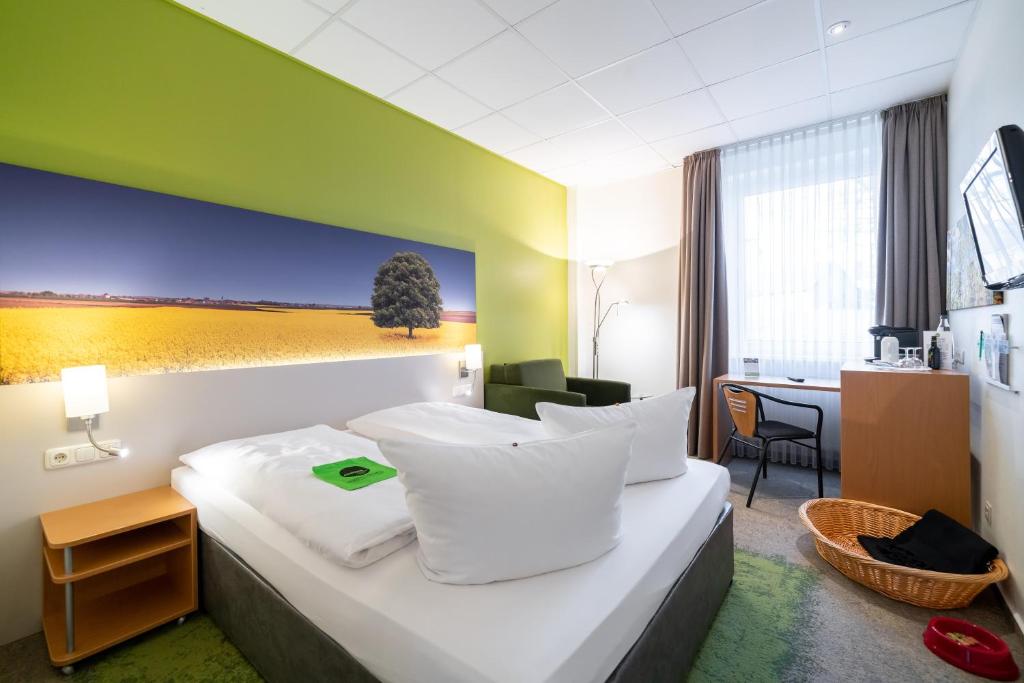 Postel nebo postele na pokoji v ubytování Anders Hotel Walsrode