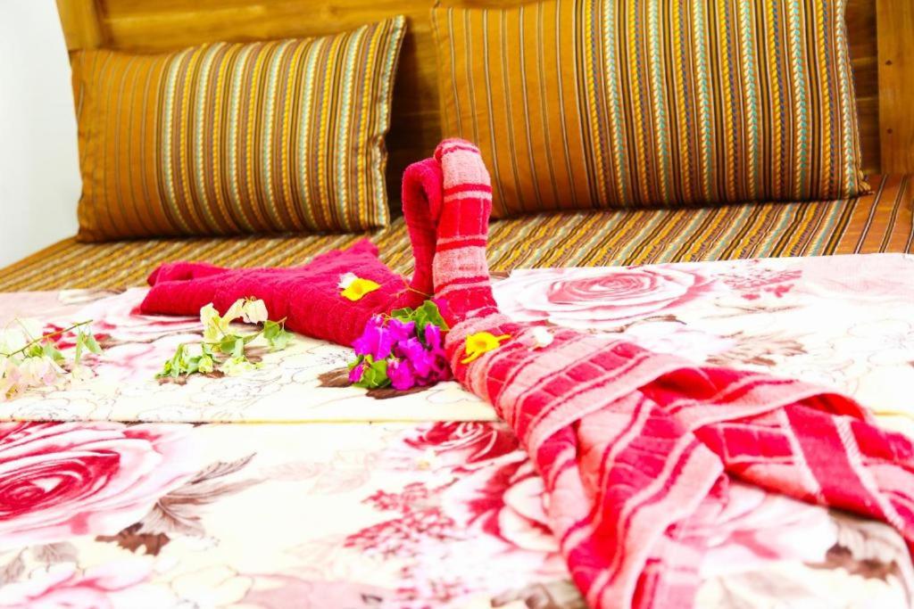 En eller flere senge i et værelse på Indusara Villa Bentota