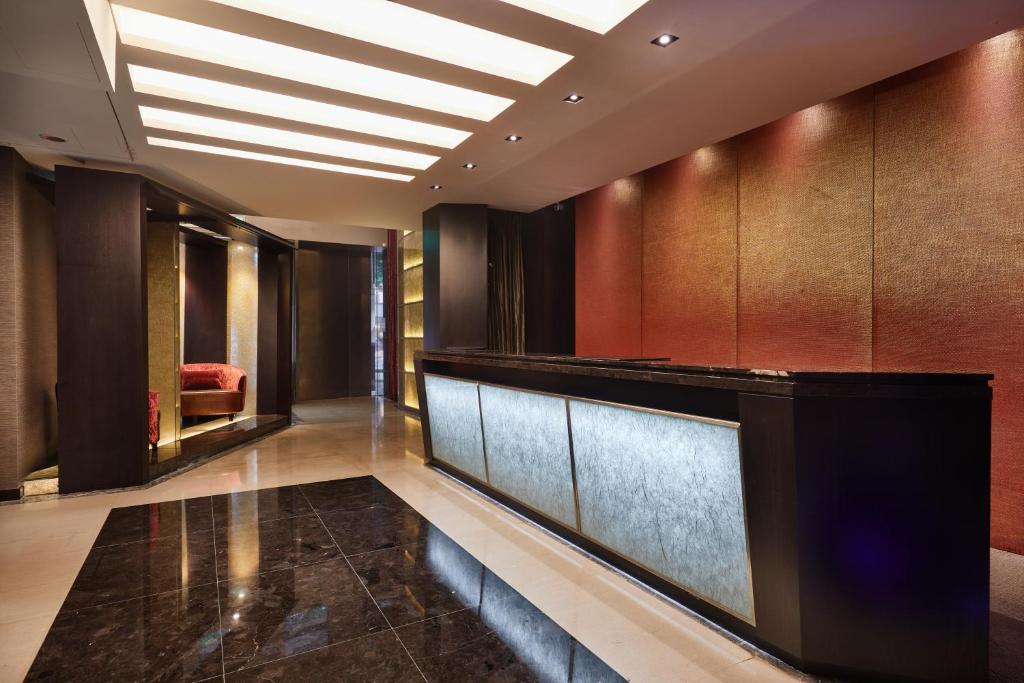 a lobby of a hotel with a reception desk at The Tango Hotel Taipei Nanshi in Taipei