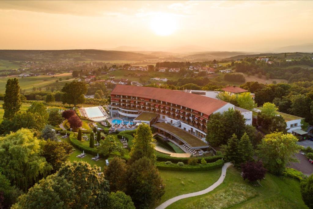an aerial view of a building with a resort at Hotel & Spa Der Steirerhof in Bad Waltersdorf