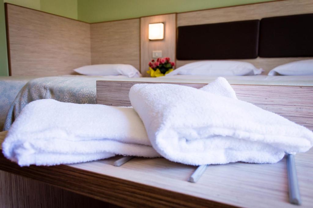 Postel nebo postele na pokoji v ubytování Hotel Dei Sette