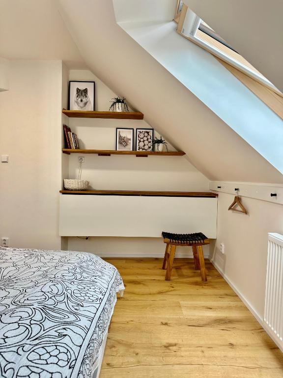 Postel nebo postele na pokoji v ubytování Molinaro Apartmány Jeseníky