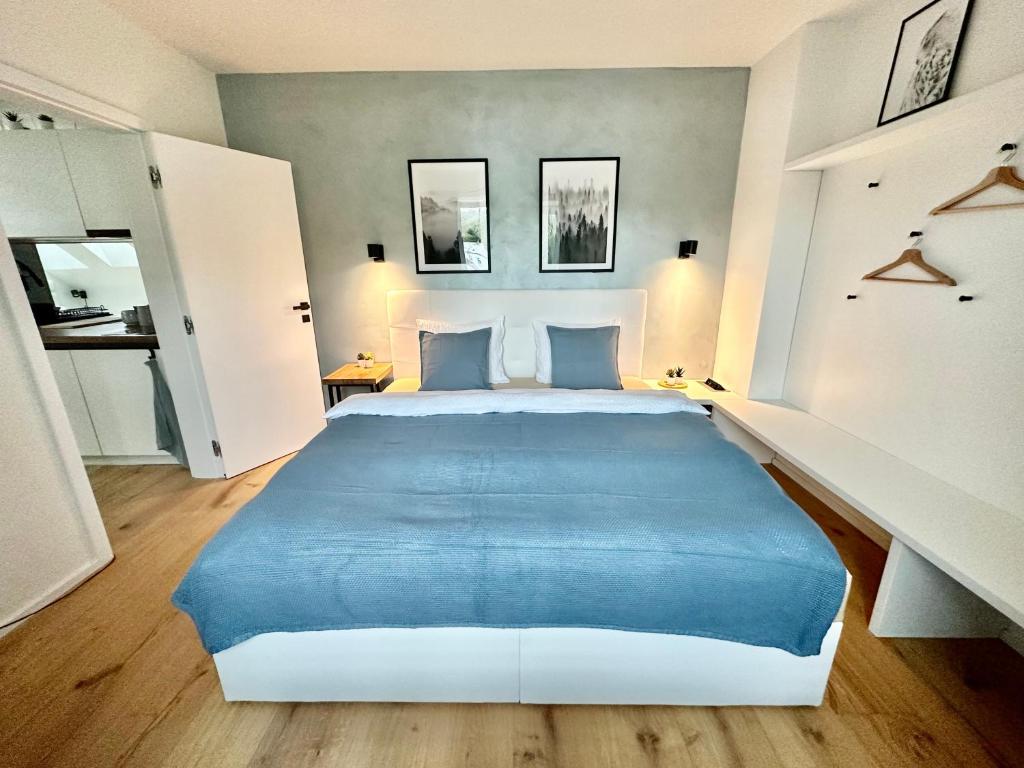 Postel nebo postele na pokoji v ubytování Molinaro Apartmány Jeseníky