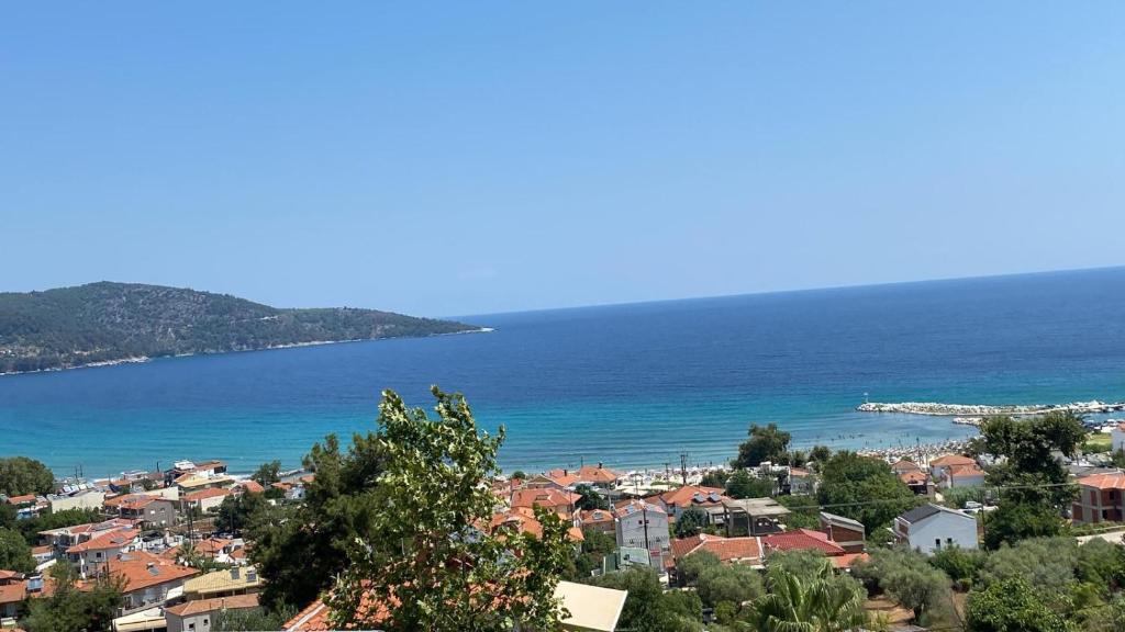 a view of a city and the ocean at INROY SEA VIEW APARTMENTS in Skala Potamias