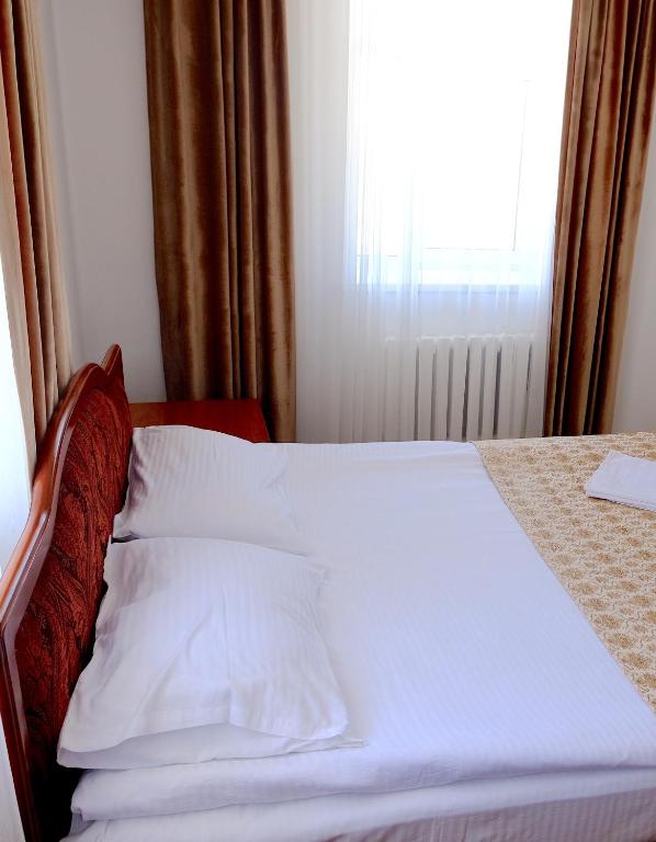 Postel nebo postele na pokoji v ubytování Jansyn Hotel Restaurant