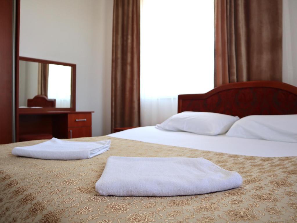 Postel nebo postele na pokoji v ubytování Jansyn Hotel Restaurant