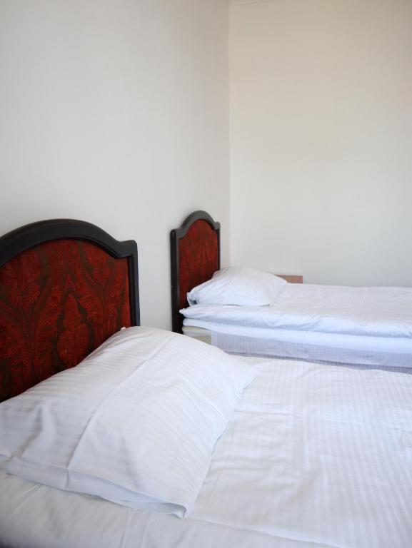 Postel nebo postele na pokoji v ubytování Jansyn Hotel Restaurant