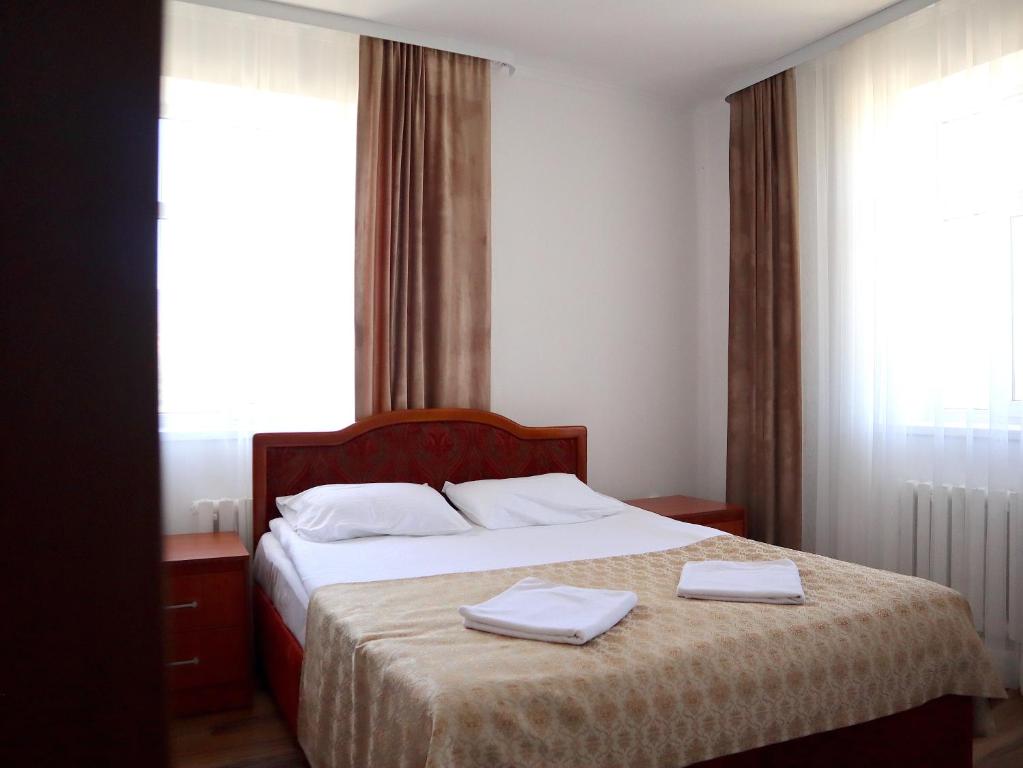 Postel nebo postele na pokoji v ubytování Jansyn Hotel Restaurant