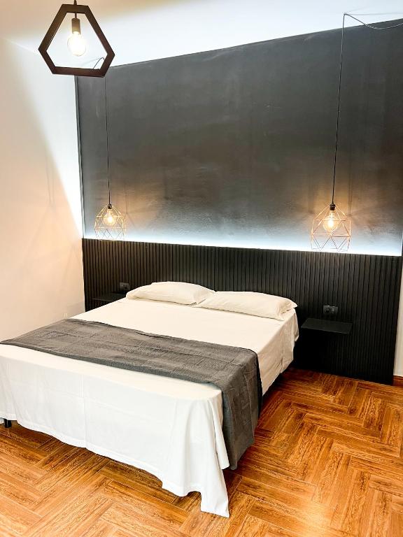 Postel nebo postele na pokoji v ubytování The Apartment Agrigento