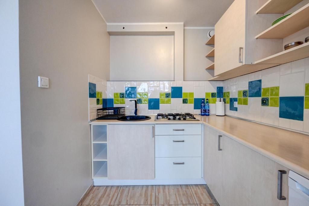 Kuchyň nebo kuchyňský kout v ubytování Apartament Szczecin Kobalt - Kaskada