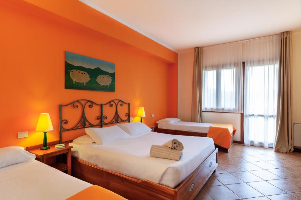 Posteľ alebo postele v izbe v ubytovaní iH Hotels Le Zagare Resort