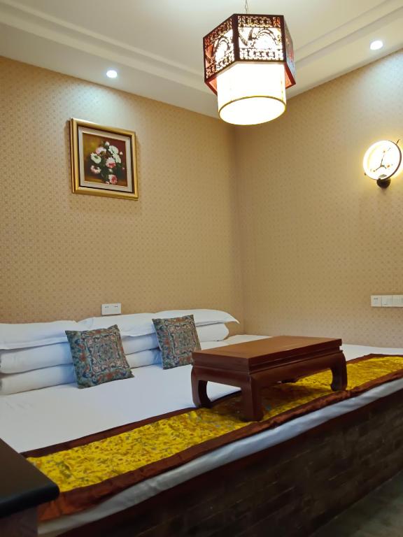 Posezení v ubytování Pingyao Hu lu wa Home Inn