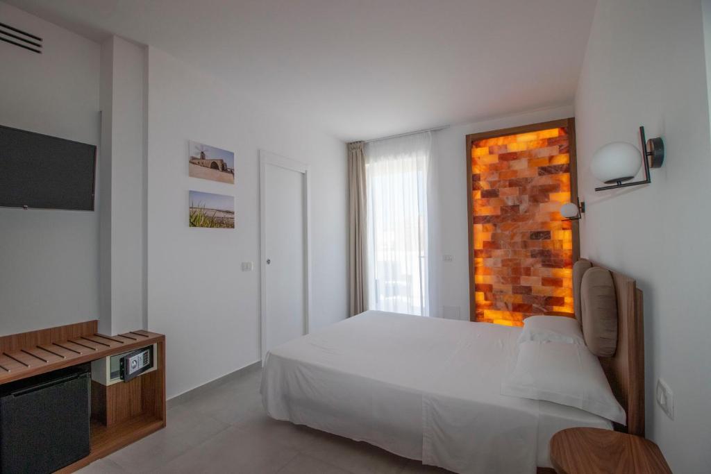 Postel nebo postele na pokoji v ubytování Hotel Arte Mare