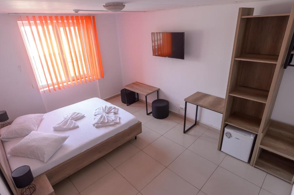 Postel nebo postele na pokoji v ubytování Hotel Proton K3
