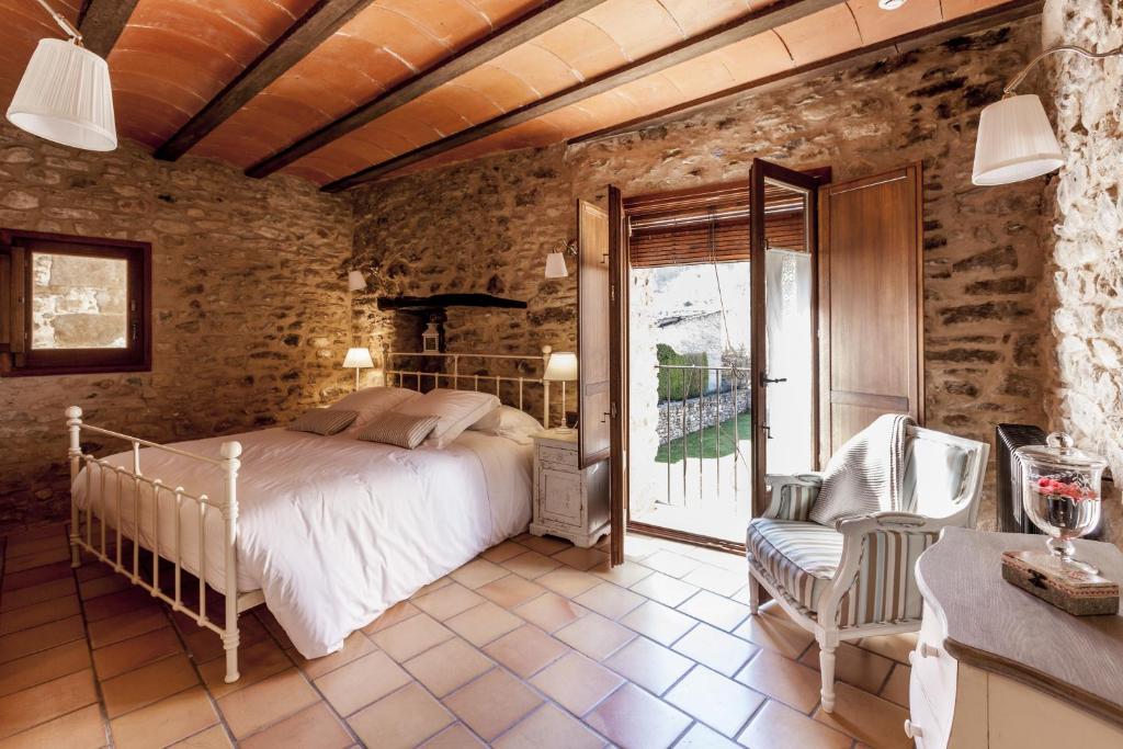 Postel nebo postele na pokoji v ubytování Hotel Mas la Ferreria