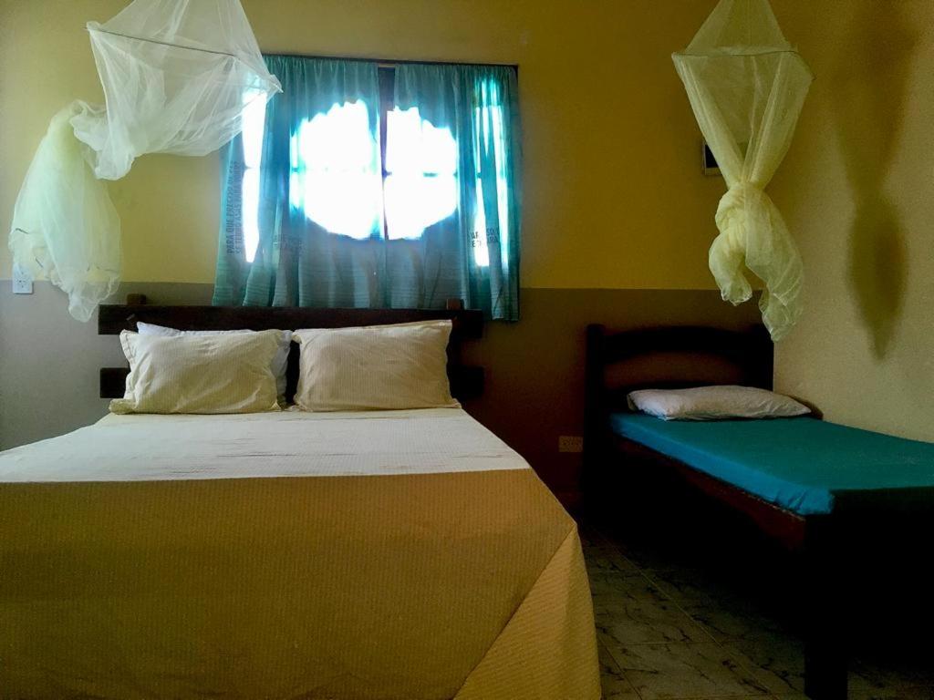 Ein Bett oder Betten in einem Zimmer der Unterkunft Falésias de Carapibus