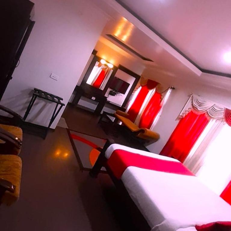 Postel nebo postele na pokoji v ubytování kurinji residency