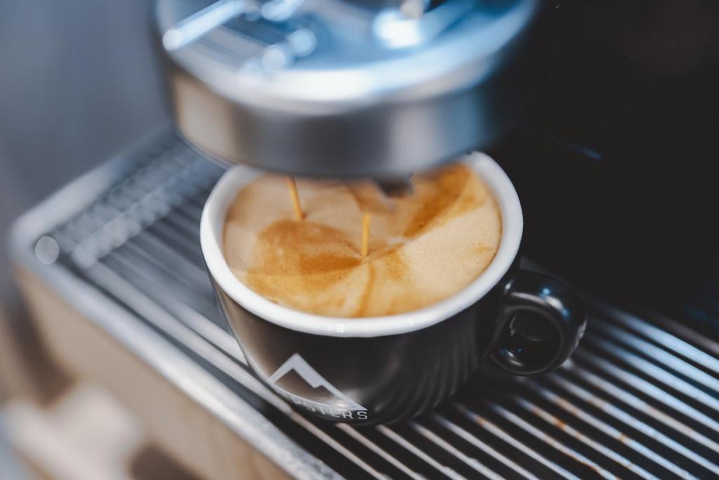 Coffee and tea making facilities at Nikolaus by AvenidA Panoramic Wellness Suites