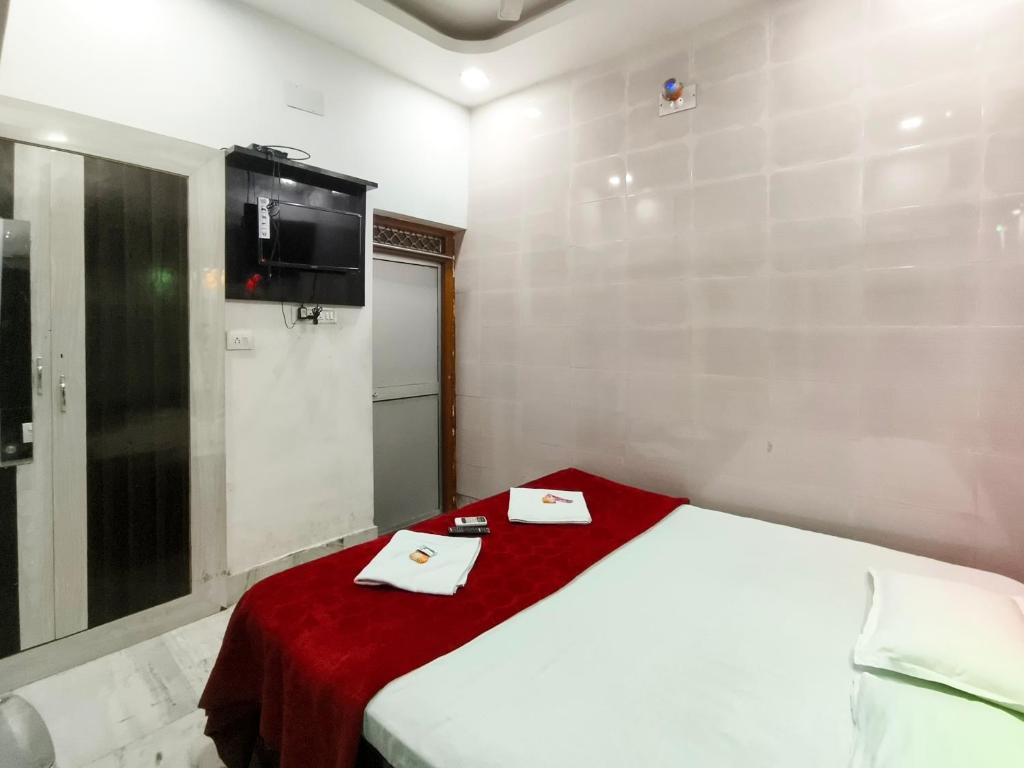 Postel nebo postele na pokoji v ubytování Bobby Premium Residency 350m from Jagannath temple
