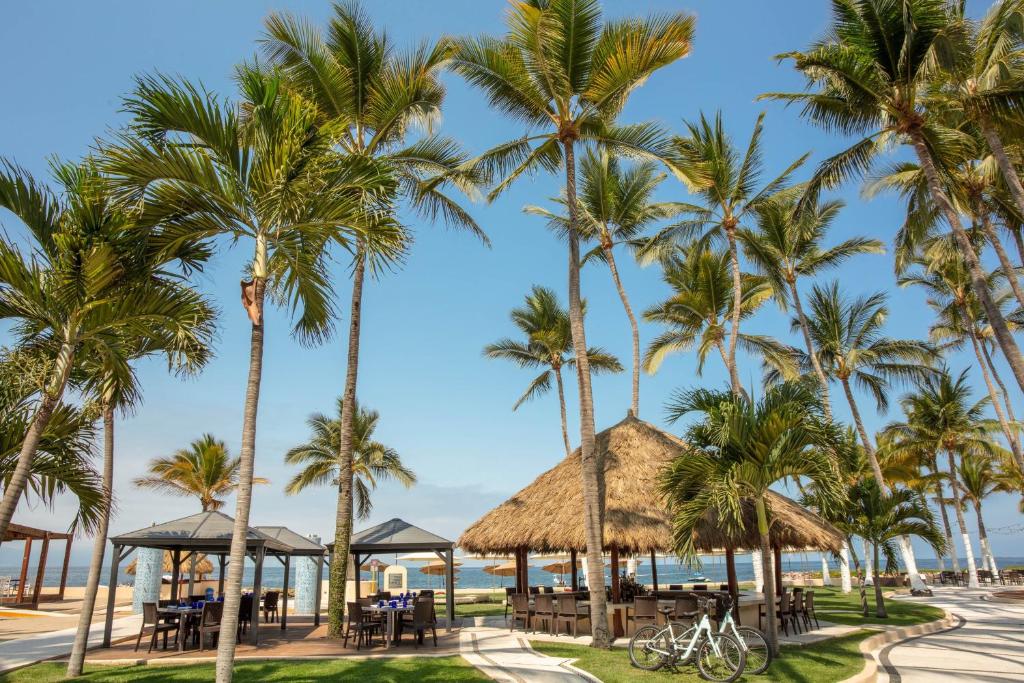 a view of the beach and palm trees at The Westin Resort & Spa, Puerto Vallarta in Puerto Vallarta