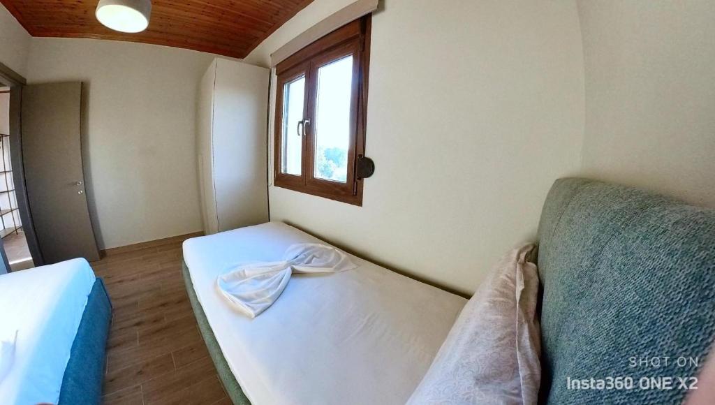 Postel nebo postele na pokoji v ubytování Villa Potamia