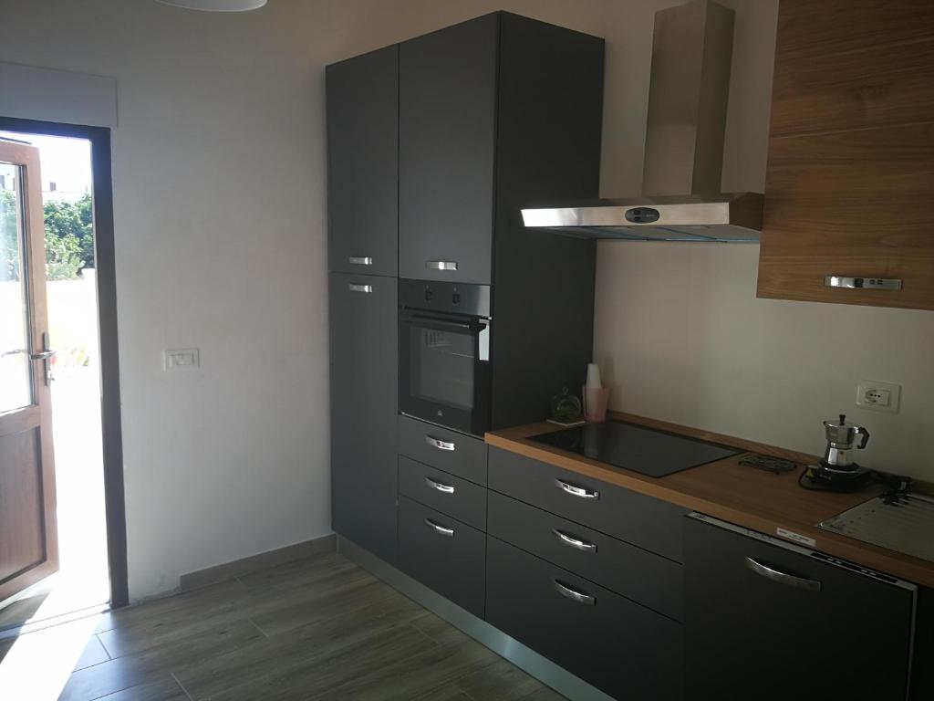 Kuchyň nebo kuchyňský kout v ubytování DonaLisa