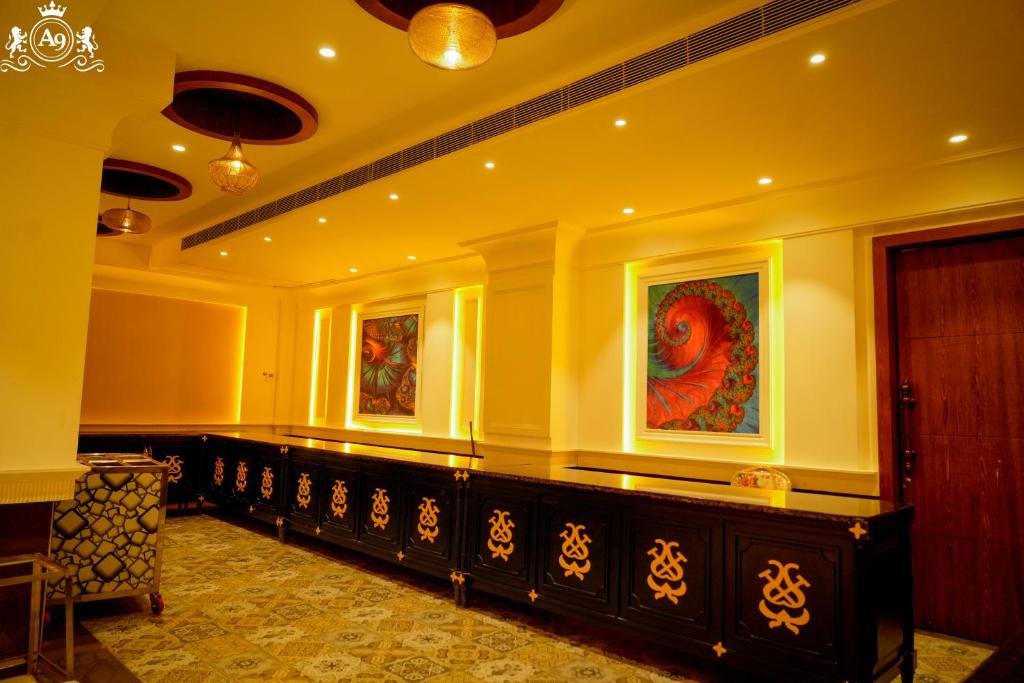 a room with a long bench in a building at Hotel A9 Barnala in Barnāla
