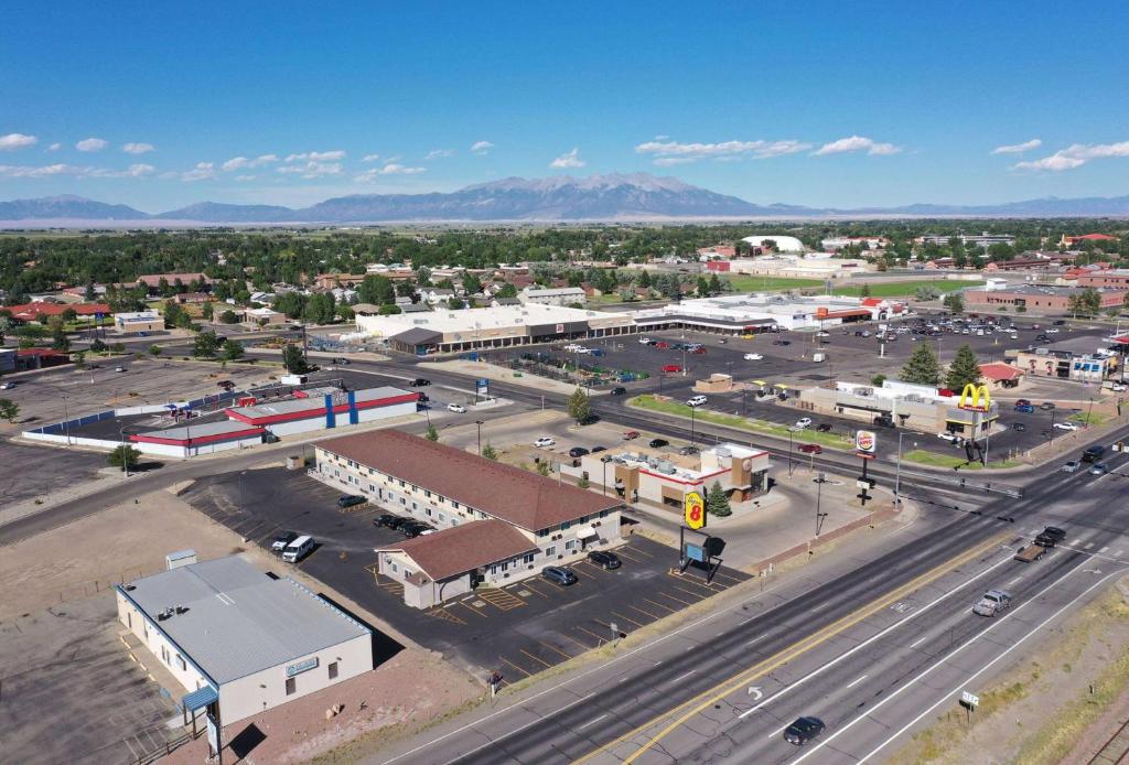 an aerial view of a city with a street at Super 8 by Wyndham Alamosa in Alamosa